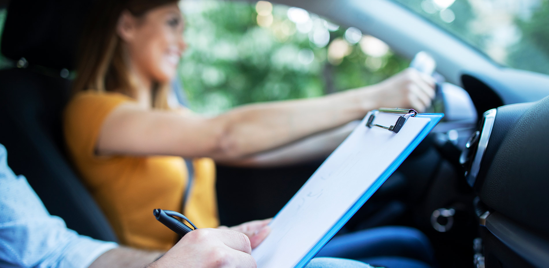 Female with driving instructor